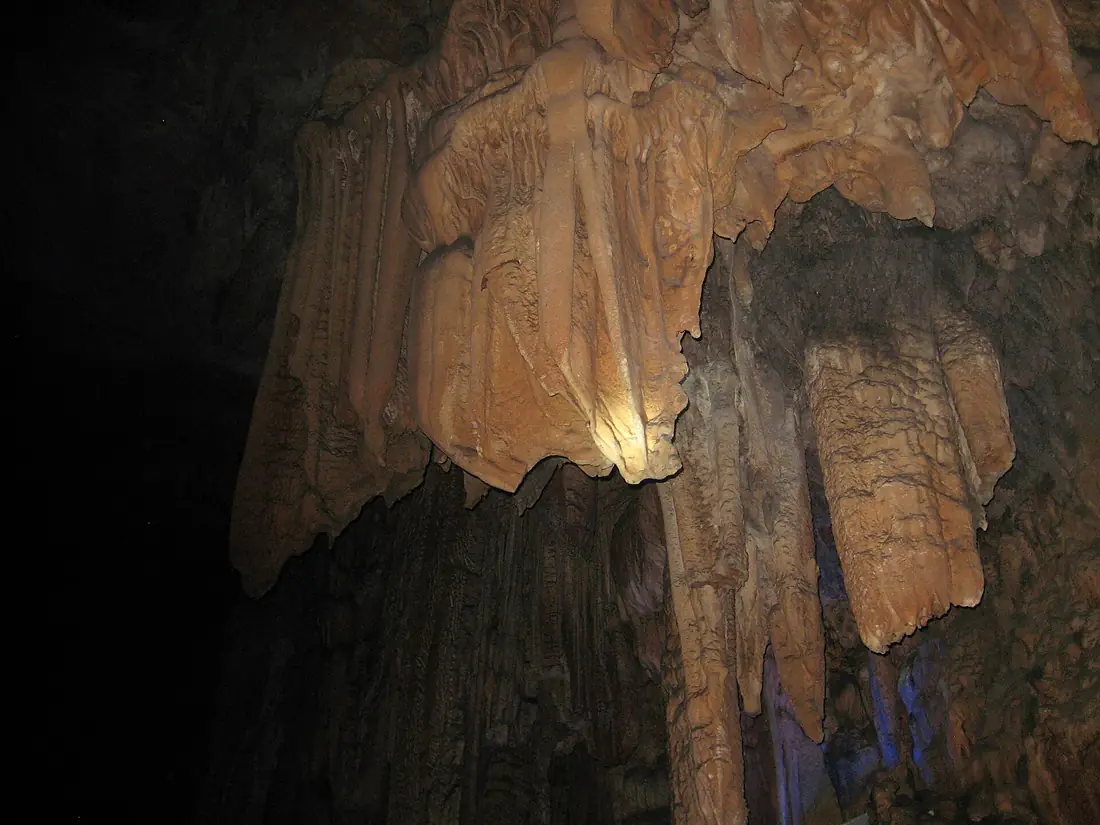 Stone curtains on display at Reed Flute Cave